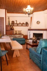 a living room with a couch and a fireplace at Portaria Heritage House in Portaria