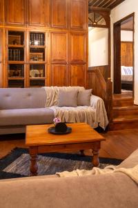 a living room with a couch and a coffee table at Portaria Heritage House in Portaria