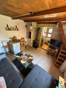 an overhead view of a living room with a couch and a kitchen at Two Olives Vacation Homes in Slatina Varoš
