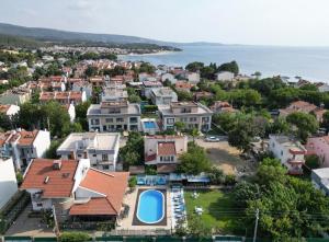 an aerial view of a town with houses at Dardanos Pension in Hamidiye