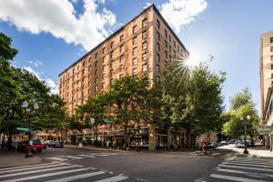 a large brick building on a city street at Heathman Hotel in Portland