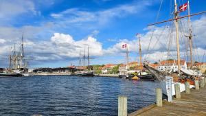 a group of boats are docked at a marina at 84286-Ebeltoft-Ndr-Strandvej-3-M in Ebeltoft