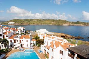 arial view of a village with a pool and houses at Comitas Tramontana Park in Fornells