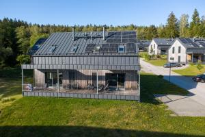 an overhead view of a house with solar panels on it at Lipno Verde in Lipno nad Vltavou