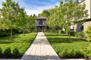 a walkway in front of a house with trees at Duchamp Healdsburg in Healdsburg