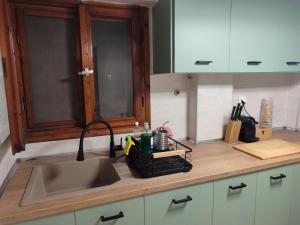 a kitchen with a sink and a counter top at The Vintage House in Nea Moudania +12 photos