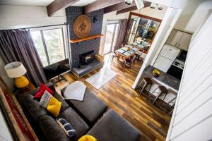 an overhead view of a living room with a couch and a fireplace at Mammoth's Best Location! 2BRLoft by Canyon Lodge in Mammoth Lakes