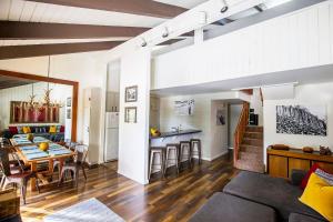 a living room and kitchen with a table and a dining room at Mammoth's Best Location! 2BRLoft by Canyon Lodge in Mammoth Lakes