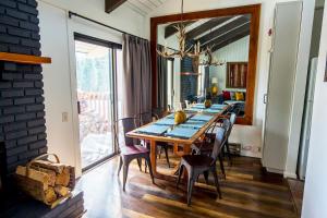 a dining room with a table and chairs at Mammoth's Best Location! 2BRLoft by Canyon Lodge in Mammoth Lakes +35 photos