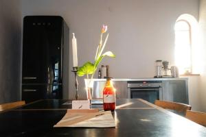 a bottle of sauce sitting on a table in a kitchen at Gladeholm - Kivik - artist studio in Kivik +12 photos