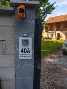 a house with a sign on a wall at La randonnée des vignobles in Essômes-sur-Marne +2 photos