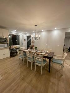 a kitchen and dining room with a table and chairs at Rancho Dreamland in Gaspar +11 photos