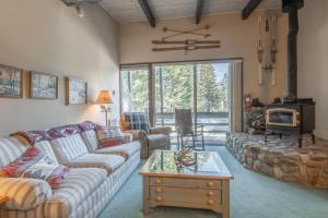 a living room with a couch and a table at Pet Friendly 2B2B on Lake Basins Bike Path! in Mammoth Lakes