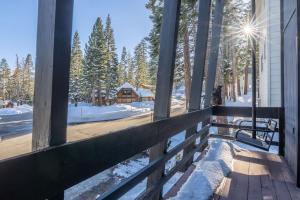 a porch with a wooden fence and a cabin at Pet Friendly 2B2B on Lake Basins Bike Path! in Mammoth Lakes