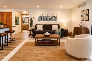 a living room with a couch and a table at Edelweiss Escape in Leavenworth