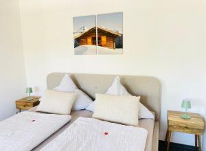 two beds in a room with two mirrors at Appartement "Loft Seeliebe" in Kreuzlingen
