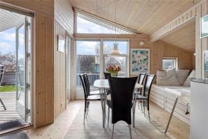 a dining room with a table and chairs at 30101-Malling-Noddevaenget-5-A in Malling +14 photos