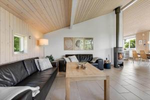 a living room with a couch and a table at C11333-Tarm-Laksestien-6 in Tarm +31 photos