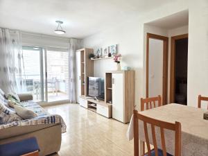 a living room with a couch and a table at Apartamento Trebol 2 in Oropesa del Mar