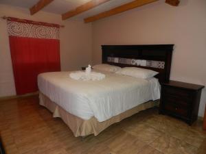 a bedroom with a bed with a candle on it at CASA DESERT in San Pedro de Atacama