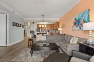 a living room with a couch and a kitchen at Sanctuary at Redfish 2115 by Newman-Dailey in Santa Rosa Beach +67 photos