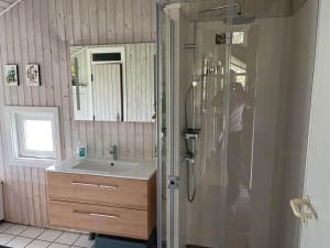 a person taking a picture of a shower in a bathroom at M396-Vaeggerlose-Torilisvej-3 in Bøtø By +16 photos
