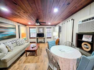 a living room with a couch and a table at #09 - Large Lakeview One Bedroom- Pet Friendly in Hot Springs