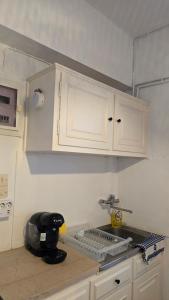 a kitchen with a mixer on a counter top at Teos Sunset View Apartment in Batsi