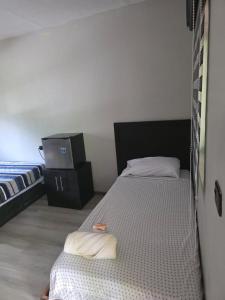 Postel nebo postele na pokoji v ubytování Hotel mg