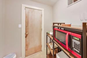 a kitchen with a red microwave on a counter at Quiet Studio near Glen Park in San Francisco