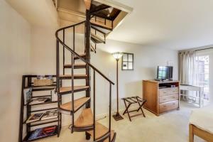 a spiral staircase in a room with a bedroom at Quiet Studio near Glen Park in San Francisco