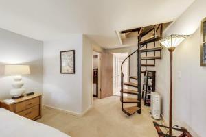 a bedroom with a spiral staircase in a room at Quiet Studio near Glen Park in San Francisco +8 photos