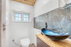 a bathroom with a sink and a toilet at L40-Rodby-Glentevej-11 in Rødby +14 photos