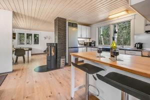 a kitchen with a wooden counter top in a room at C11252-hemmet-Anevej-7 in Hemmet