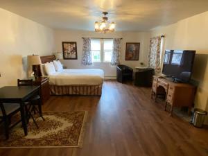 a hotel room with a bed and a flat screen tv at Spacious Private Suite ParksBoatingGolf in San Francisco