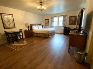 a bedroom with a bed and a table and chairs at Spacious Private Suite ParksBoatingGolf in San Francisco