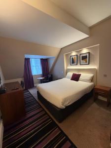 a hotel room with a bed and a window at Fenwick Street Hotel by EPIC, Central Rooms Near Waterfront & Liverpool ONE in Liverpool