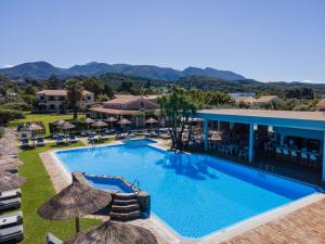 an image of the pool at the resort at Villa Afroditi by Bostonia Village in Almiros Beach