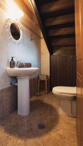 a bathroom with a sink and a toilet at Kidóni Villas in Gaïtánion +13 photos