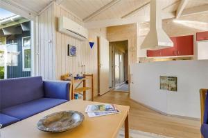 a living room with a blue couch and a table at 30098-Malling-Norsmindevej-171-K in Malling