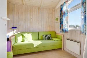 a green couch in a room with a window at 30098-Malling-Norsmindevej-171-K in Malling