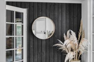 a mirror on the wall of a room at 30192-Malling-Askvaenget-13 in Malling