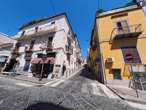 an empty street in a city with buildings at La casa di venera in Bacoli