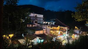 a view of a town at night at Restora Ella in Ella