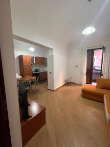 a living room with a couch and a table at Msholiday home in Cinisi