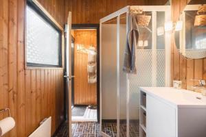 a bathroom with a shower and a sink and a mirror at M404-Gedser-Frede-Buchsvej-3 in Gedser +13 photos