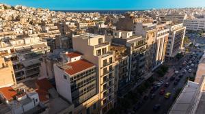 an aerial view of a city with buildings at Ormos Piraeus in Piraeus