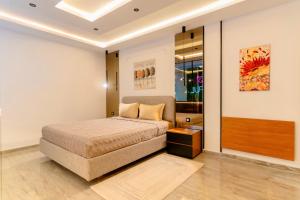 a bedroom with a bed in a room at Liveable artwork in Sousse +28 photos