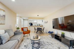 a living room with a couch and a table at Elevation Hideaway in Durango Mountain Resort