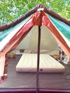a tent with a bed inside of it at Hovek Guest House in Dilijan +59 photos